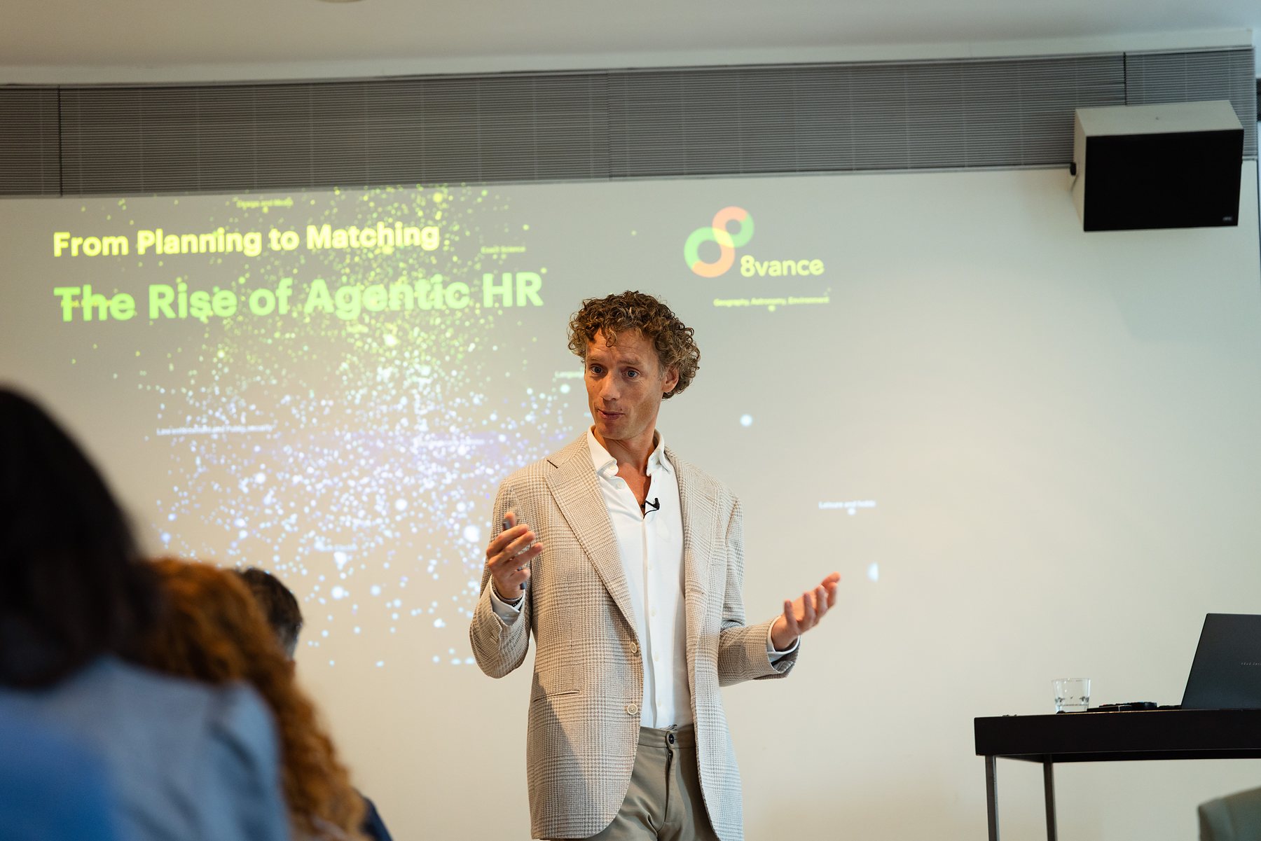 Laurens Waling speaking in front of a screen showing figures on occupations that are changing